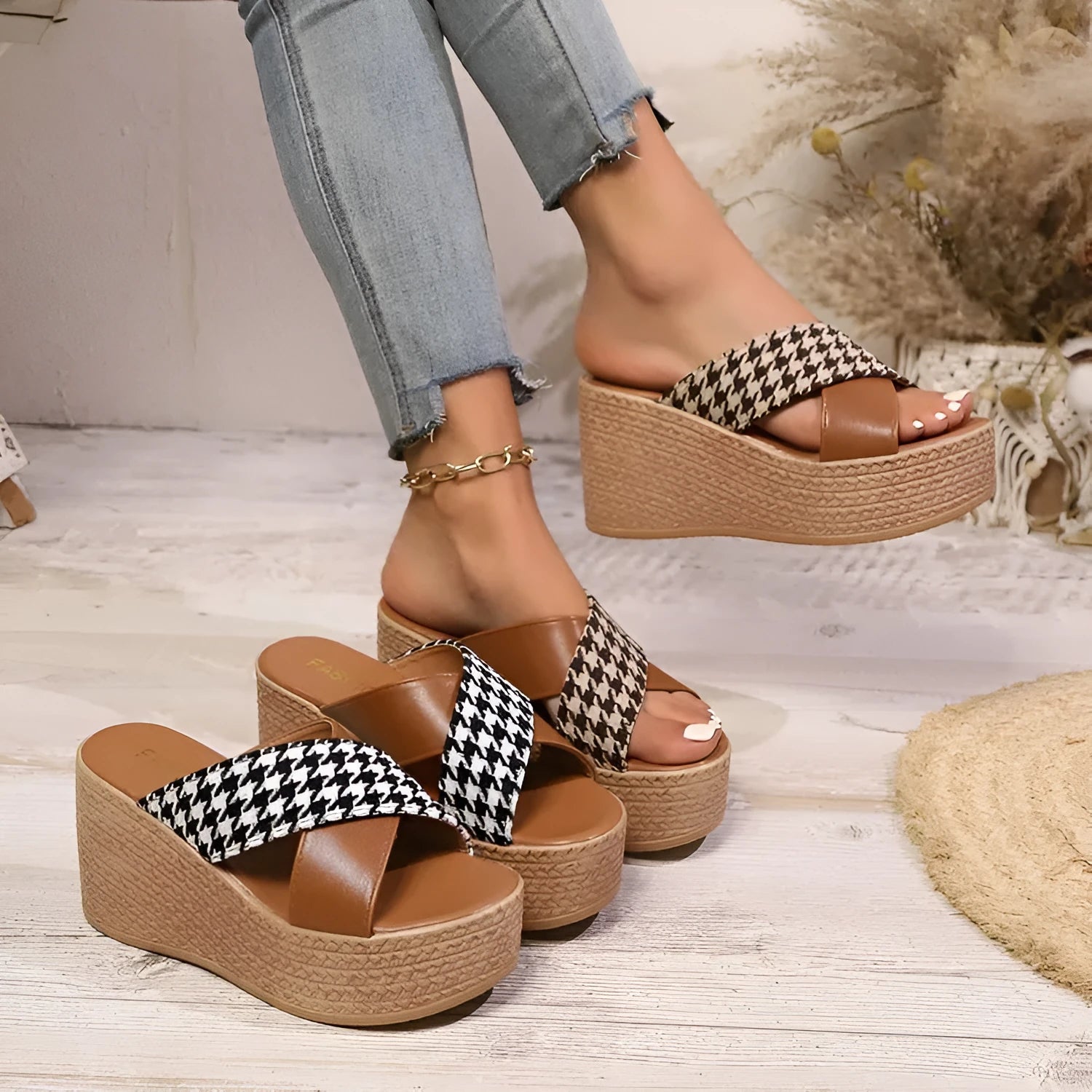 Leopard print plaid wedge sandals in brown and black with a rubber sole, shown in a casual setting.