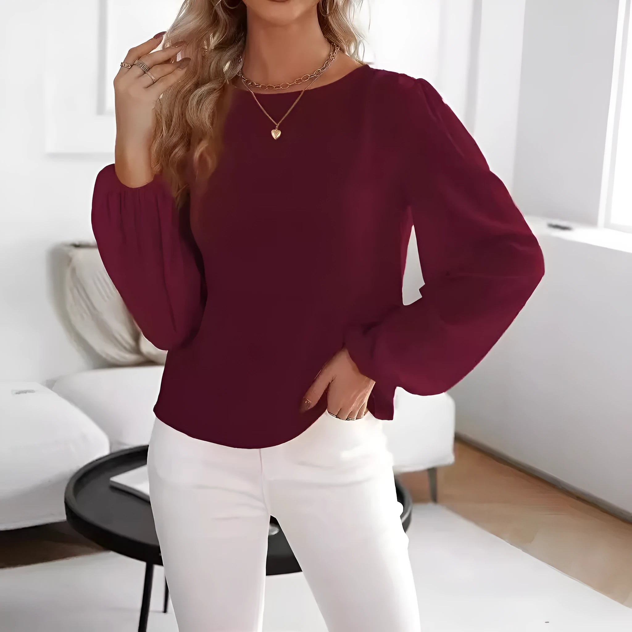 Wine red women's solid colour round neck long sleeve polyester top with button front, shown on a model.