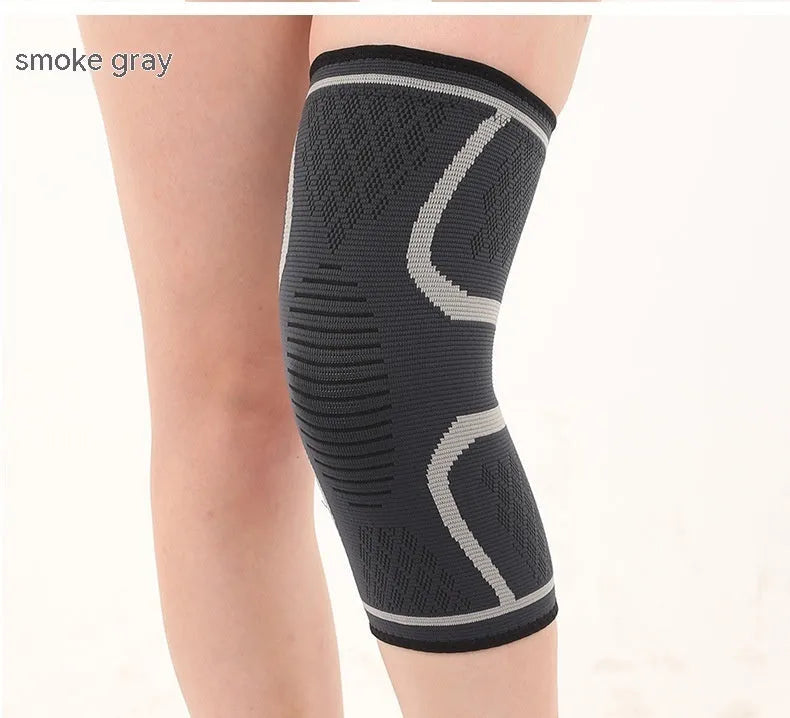 Pair of black stretch polyester sports knee pads with a textured non-slip interior.