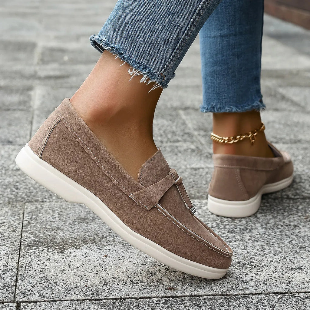 Women's casual tassel one pedal loafers in brown with round toe and low flat heel on a white background
