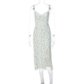Women's blue lace flower print long dress with thigh slit and black suspender straps.