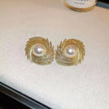 Pearl-coloured vintage flower earrings with irregular design elements on alloy electroplated construction