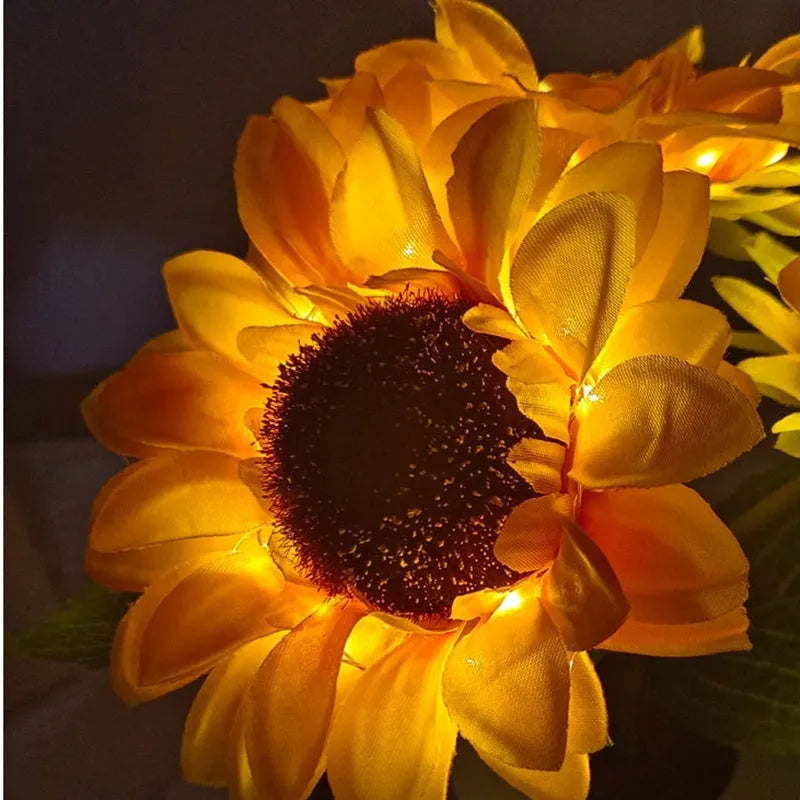 USB rechargeable artificial sunflower LED night light on table with decorative flower design