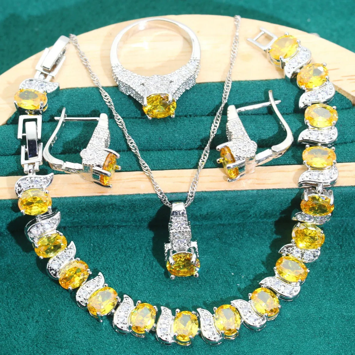 Bridal zircon jewellery four-piece set showing necklace, bracelet, earrings and ring in alloy with water wave chain