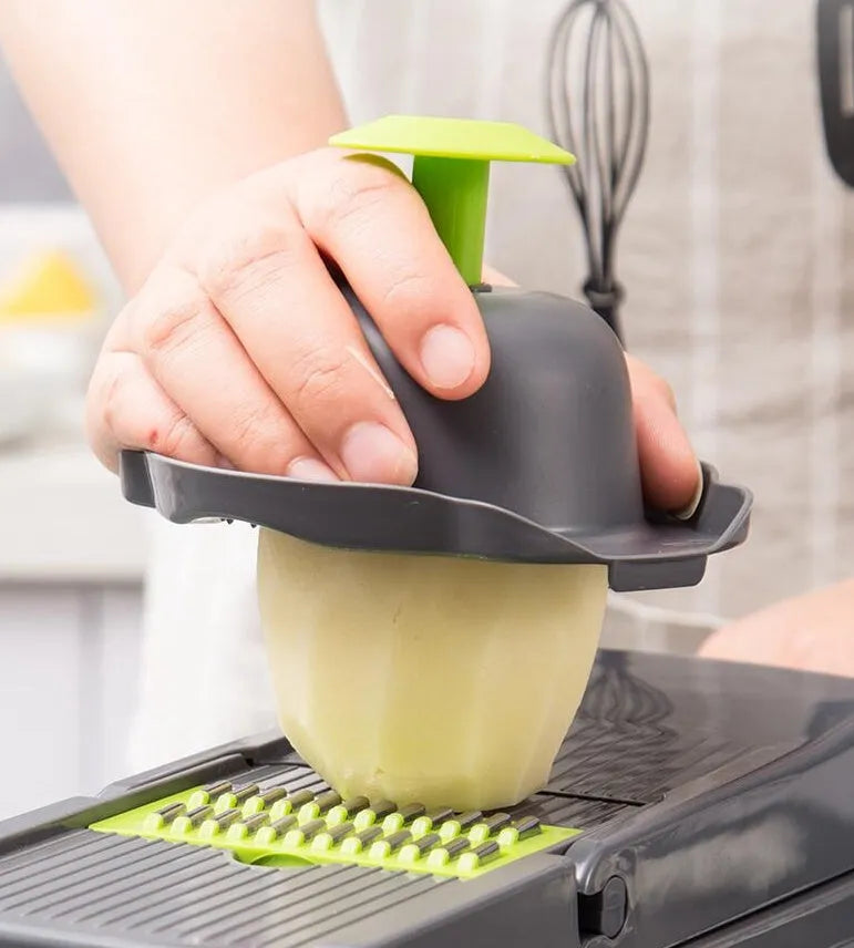 Multifunctional vegetable cutter with 7 stainless steel blades on a kitchen counter, compact 31.8 x 11.5 x 11.5 cm size