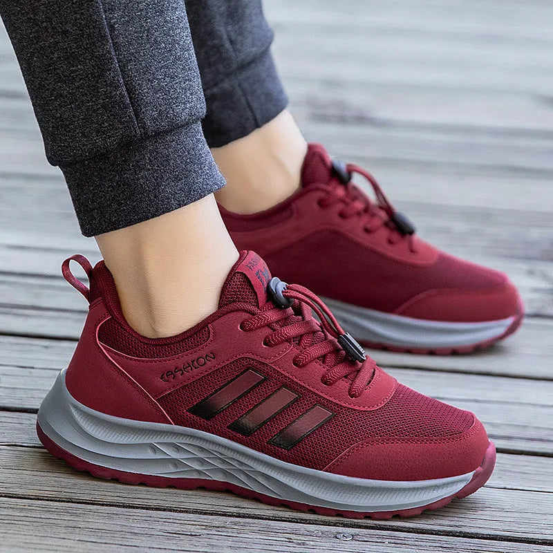 Breathable mesh casual shoes with elastic band closure in black, dark grey, purple and purplish red.