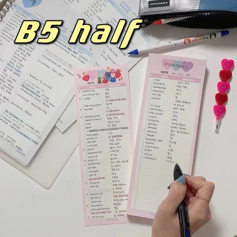 Blue B5 half-size vertical notepad with 30 sheets next to pink and purple versions.