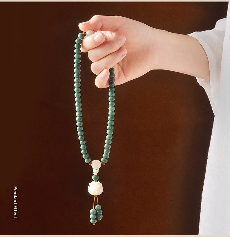 White jade bodhi seed bracelet with a double ring lotus safety buckle.