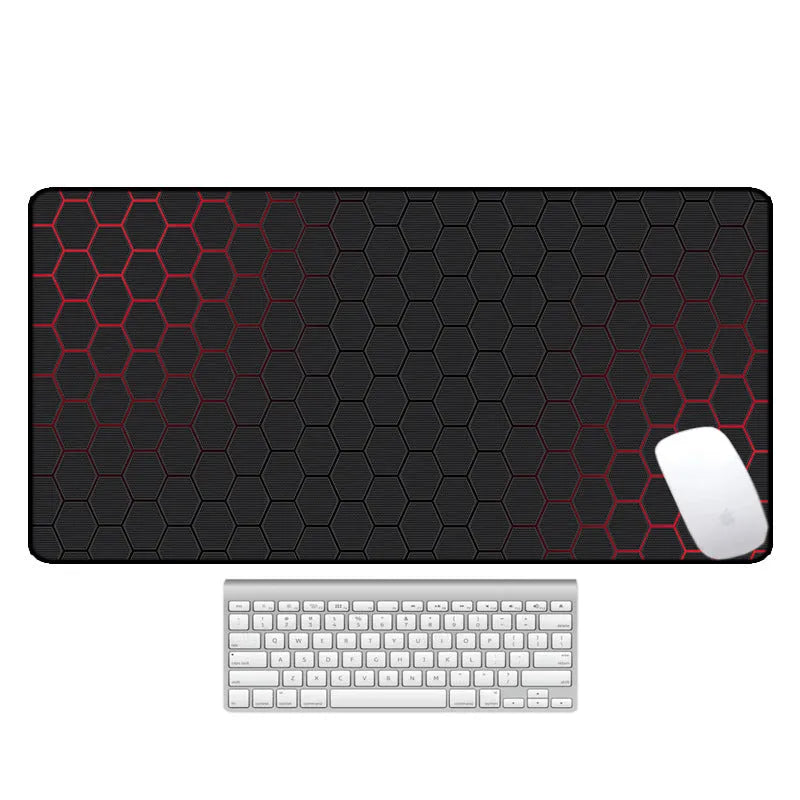 Large patterned desk mat for mouse and keyboard on a wooden desk.