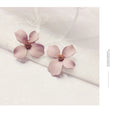 Flower-shaped stud earrings for women in alloy with white or pink electroplated finish