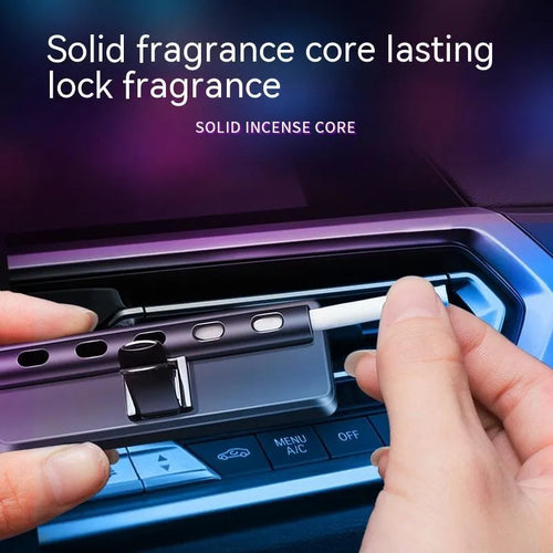 Black automobile air vent clip with LED light and aromatherapy diffuser for car odour removal.
