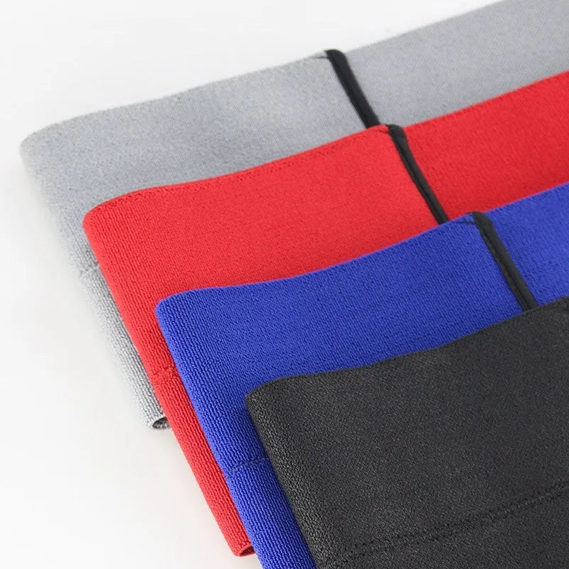 Elastic elbow support compression sleeve in red colour on a grey background