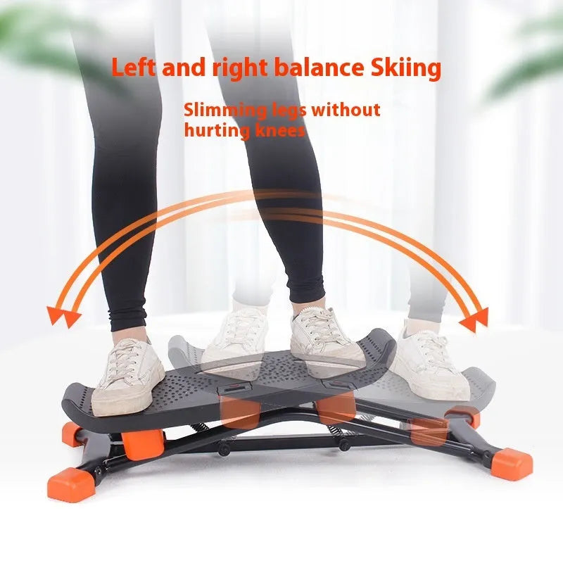 Black mini fitness skiing machine with elastic hand strap for home exercise.