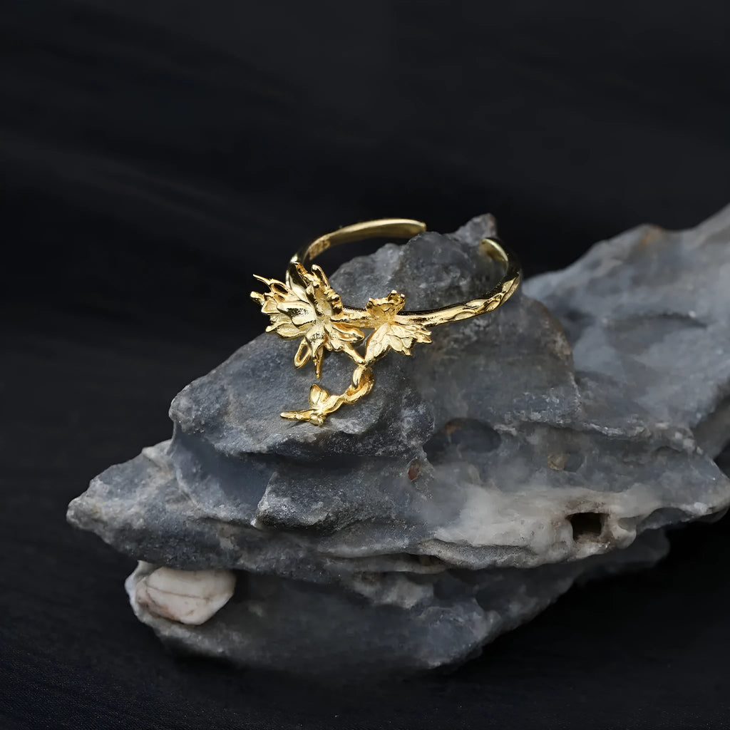 Adjustable silver ring with a detailed butterfly design in a choice of white gold or gold colour finish.