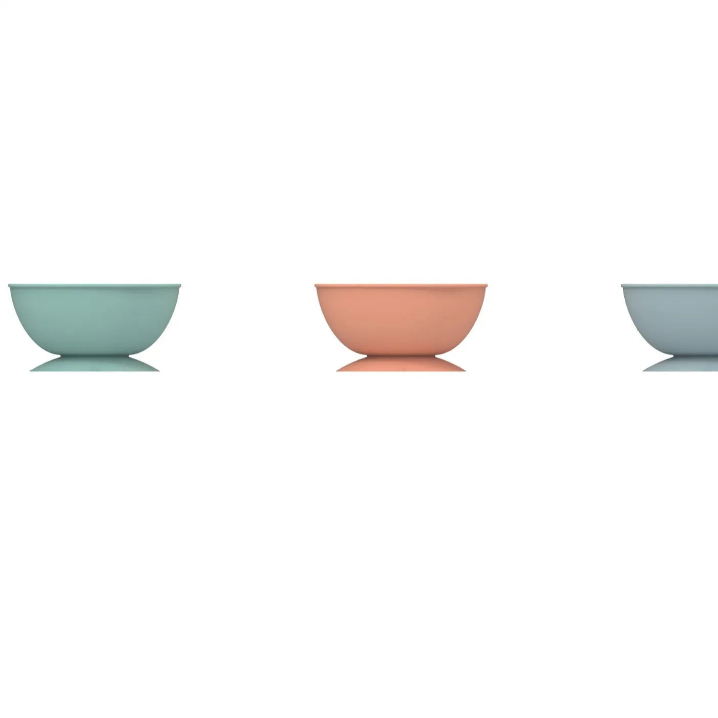 Cyan silicone dog bowl with textured licking mat surface and a suction cup base on a table.