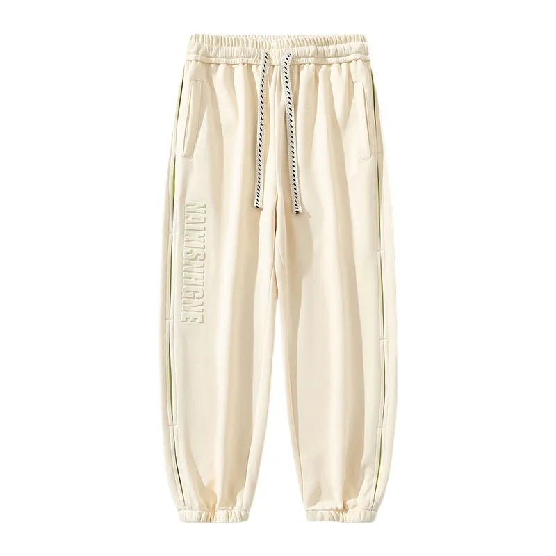 Men's black ankle banded trousers with stitching detail and cotton micro-elastic fabric