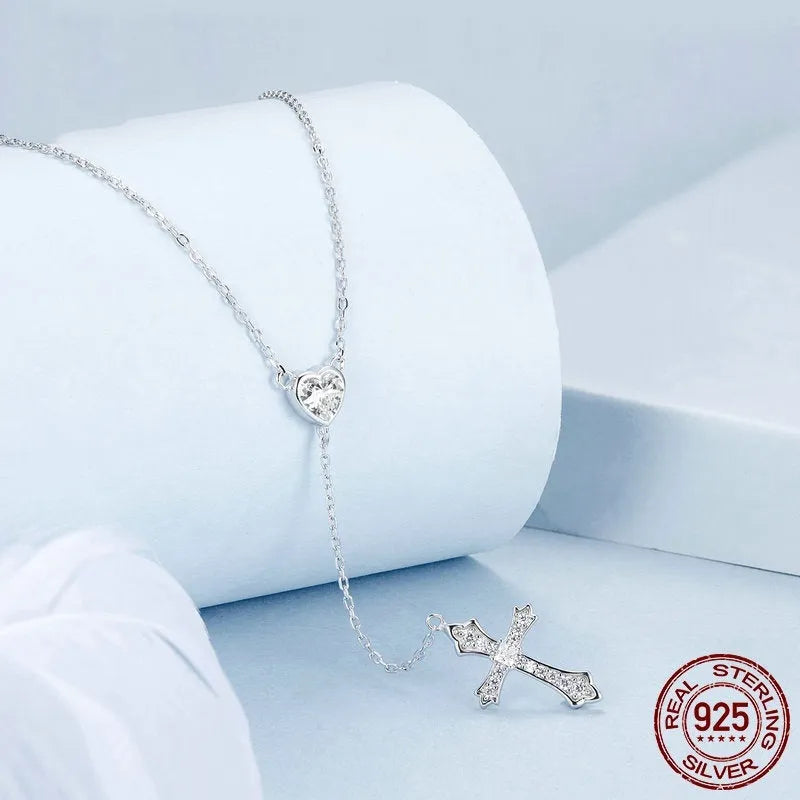 Simple V-neck love cross pendant on a silver O-link chain