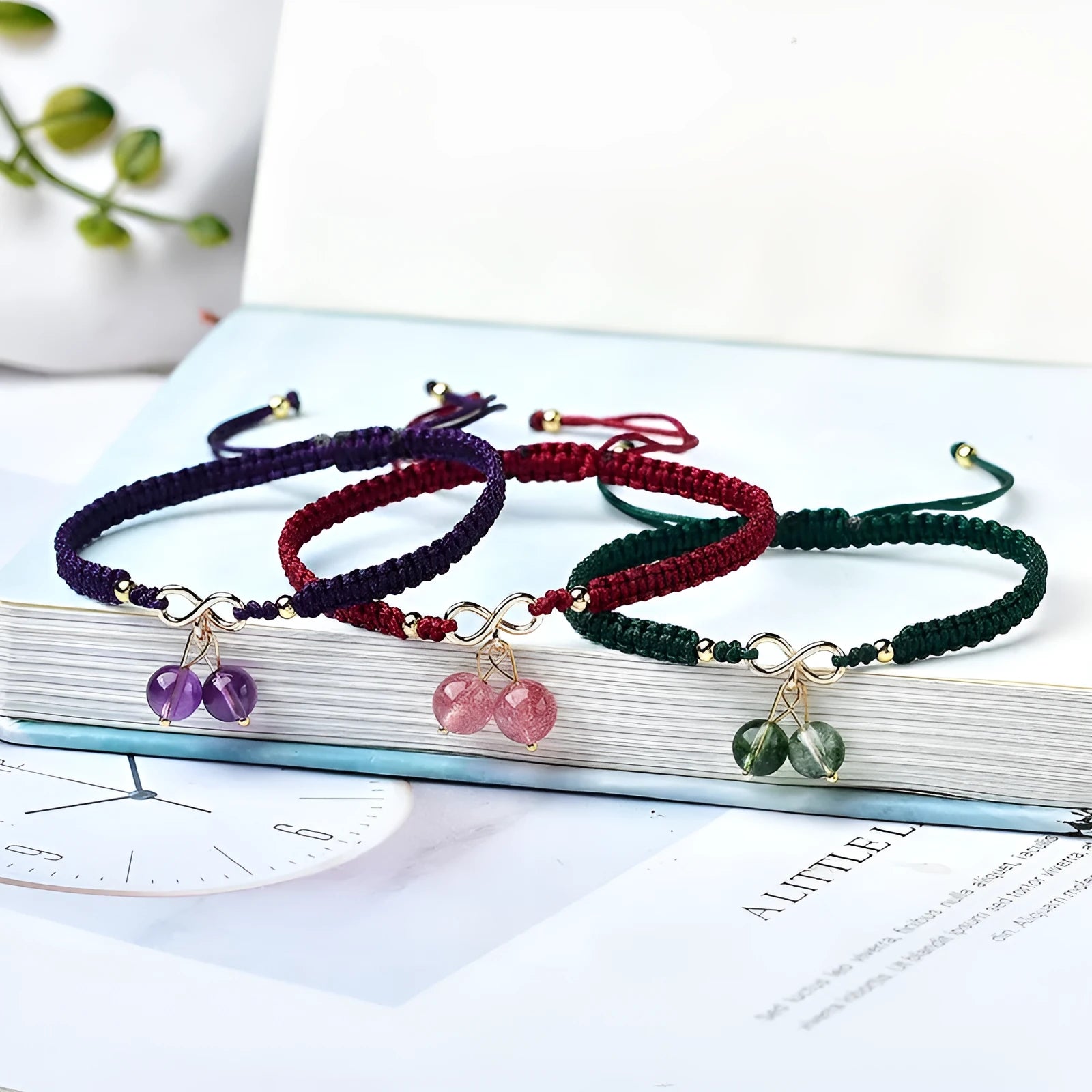 Women's natural strawberry quartz crystal cherry bracelet with adjustable cord on wrist