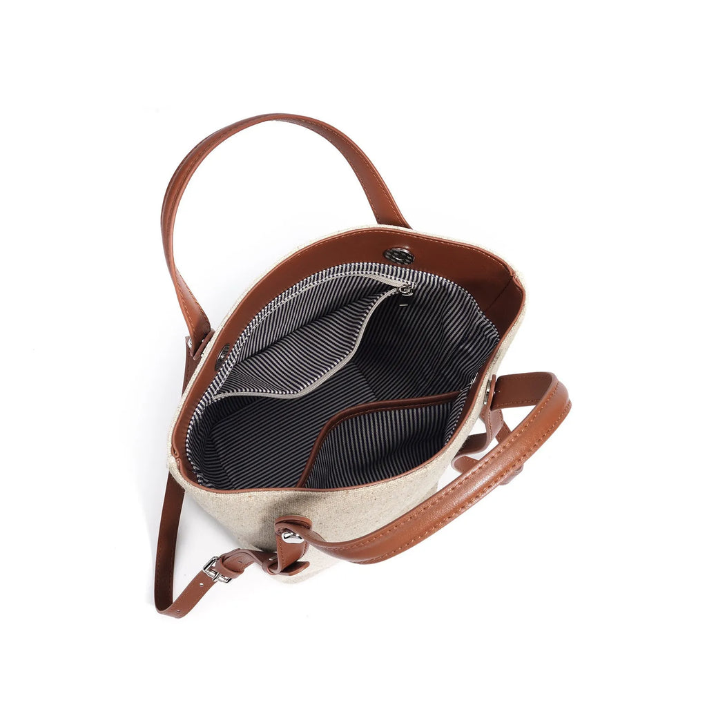 Genuine leather bucket shoulder bag in Linen Black with stitching, open outer pocket, and hand-carry strap