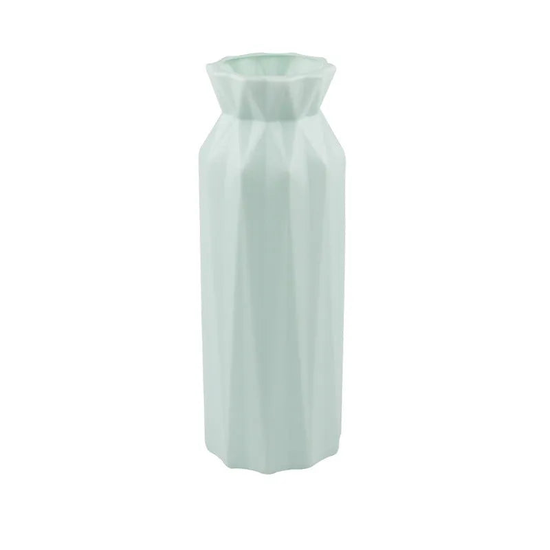 Green melamine drop-resistant vase with a wide base on a wooden table