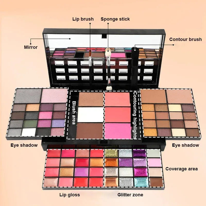 74 colour makeup palette open showing layered powder plates with eyeshadows, lip glosses, blush and contour, with mirror and brushes.