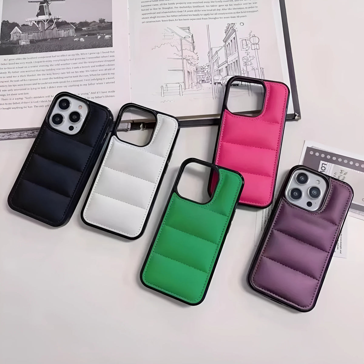 Candy down jacket phone case for iPhone 17 in black showing padded design and cut-outs