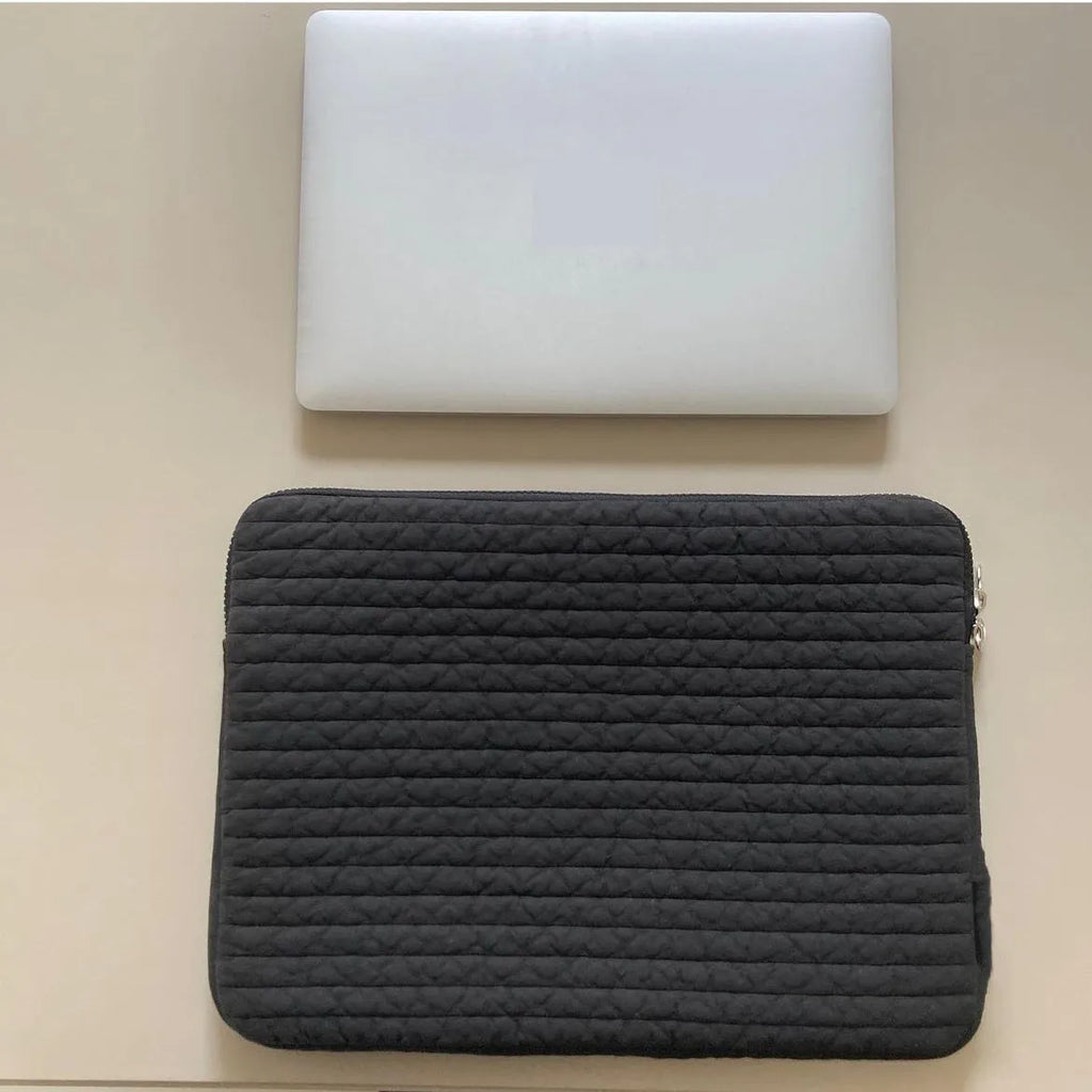 Black and white cotton cloth hand-held clutch bag for anti-seismic tablet protection.