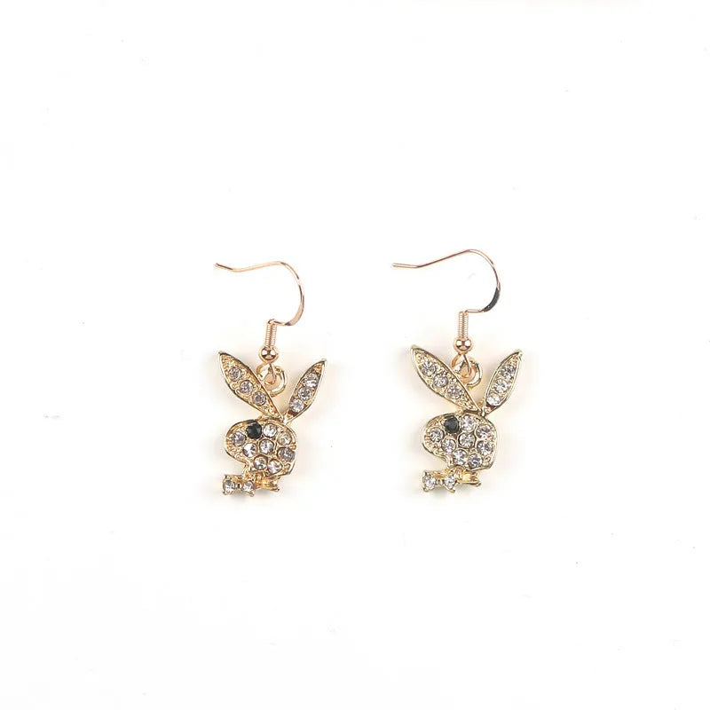 Close-up of cute rabbit stud earrings with full diamond face, in silver, pink, or gold alloy.