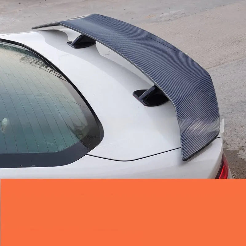 Universal punch-free fixed tail car spoiler in ABS plastic, shown in multiple finish options.