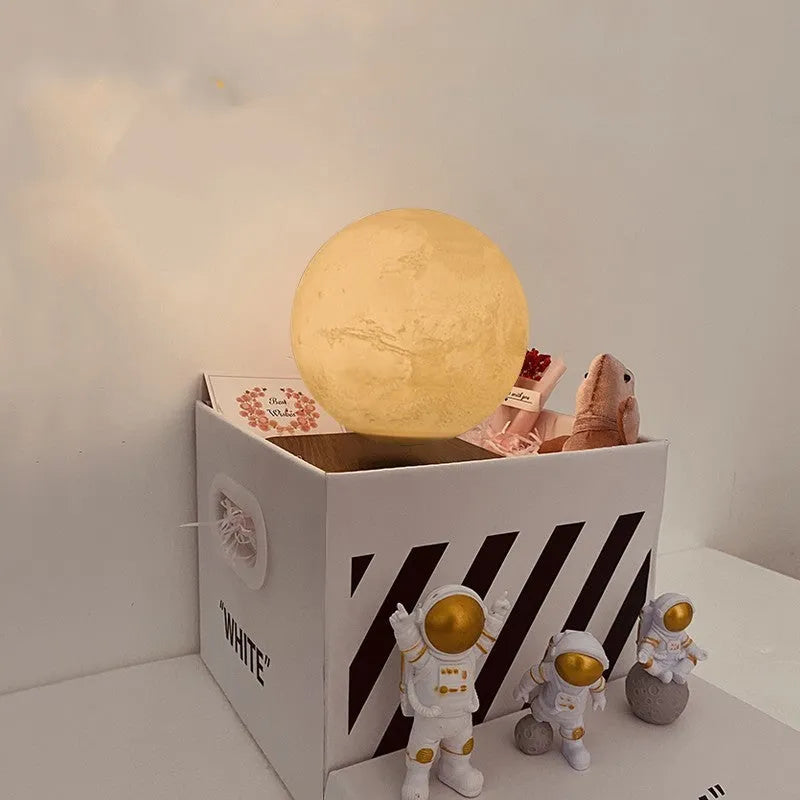 Maglev floating moon night light with LED illumination and astronaut figurines