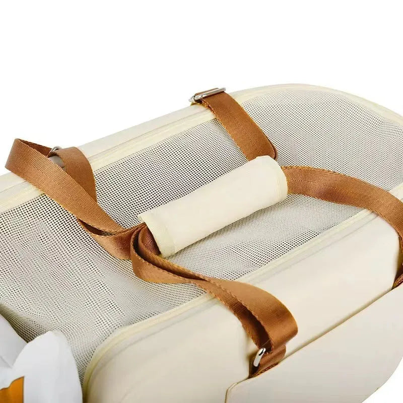 Beige hard-shell portable cat carrier with EPE padding for car and outdoor travel