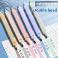 Set of double-tipped fluorescent marking pens in mixed colours on a white background.