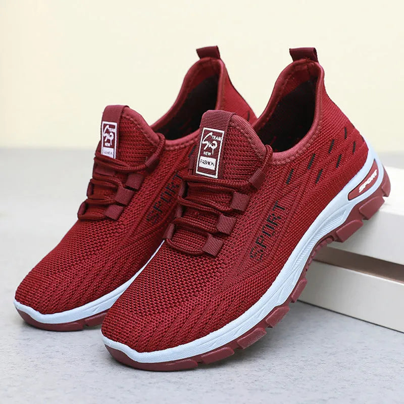Men's and women's low-top casual sneakers with round toe and soft PVC sole in multiple colours.