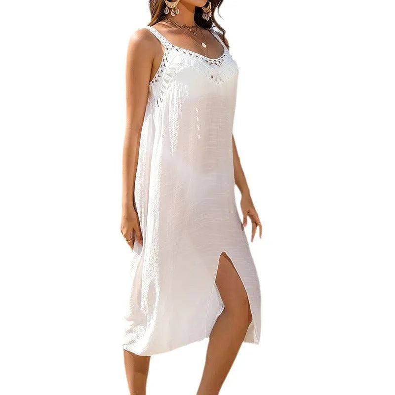 White crocheted beach dress with hollow weave pattern and bottom slit design