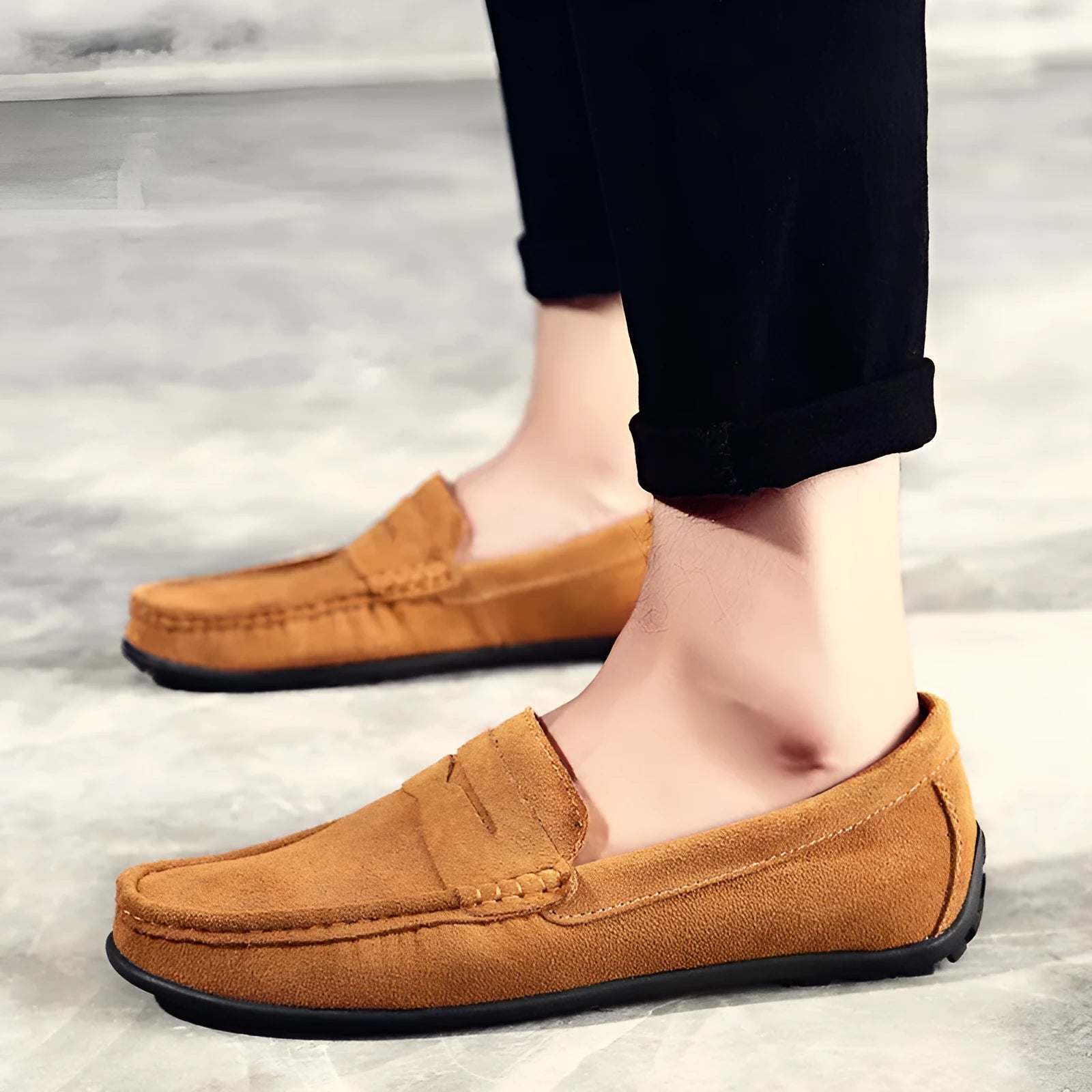 Men's suede leather Gommino loafer in brown, showing round toe and rubber sole.