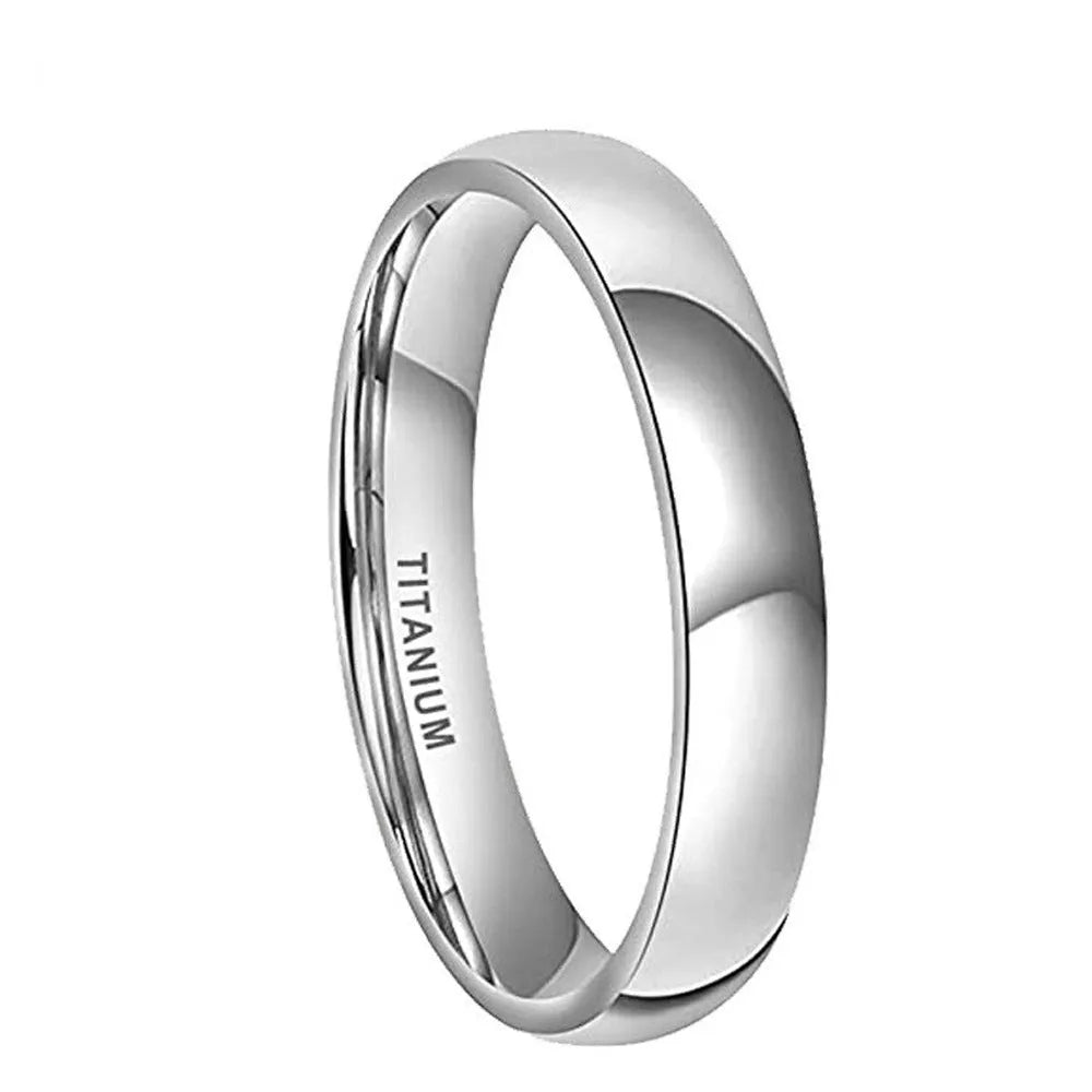 Simple silver-coloured titanium steel band ring with a matte finish on a grey background.