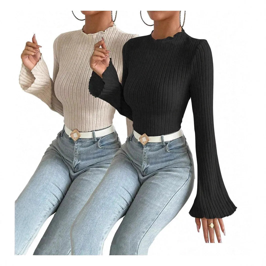 Long sleeve round neck pullover in black with lantern sleeves and a subtle sunken stripe pattern.