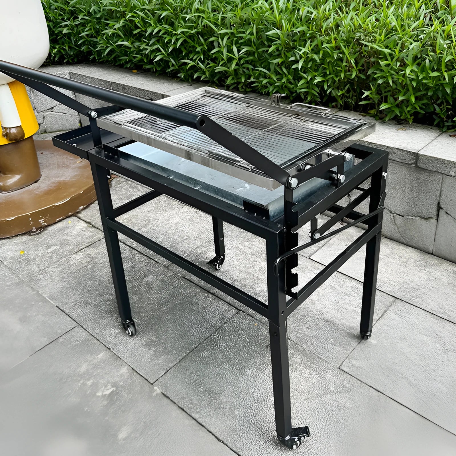 Large foldable and detachable charcoal BBQ grill oven stove for outdoor cooking.