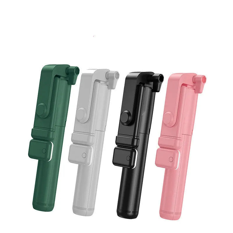 Black Bluetooth selfie stick extended from its integrated mini tripod base, holding a smartphone.