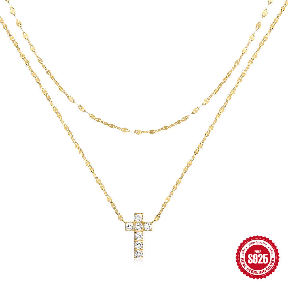Sterling silver double layer cross pendant with twin diamonds on a clavicle chain.