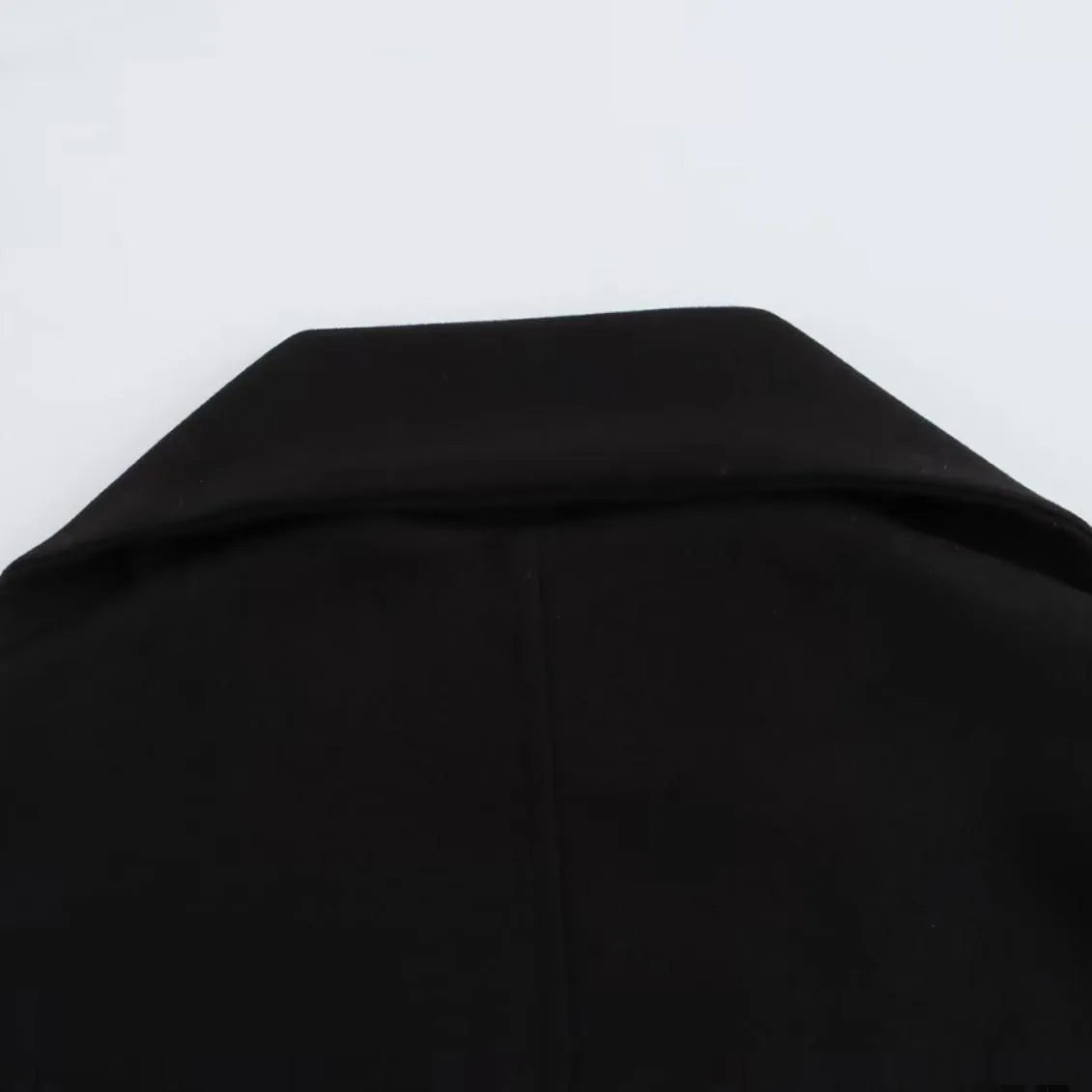 Women's long black polyester overcoat with a grey artificial fur collar, shown at full length.