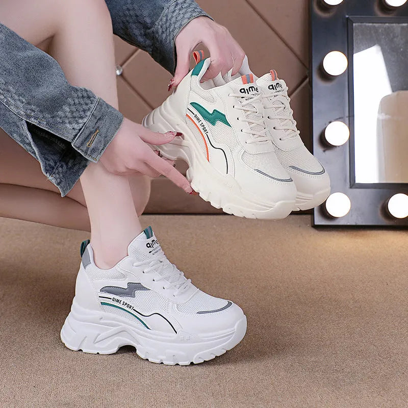 Women's white beige height increasing dad shoes with mesh upper and cross straps.