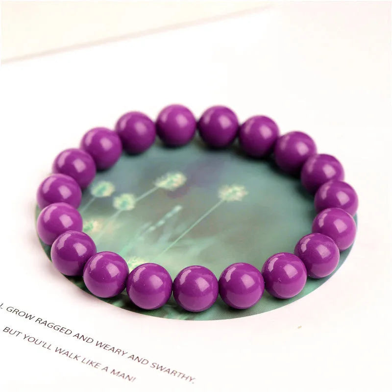 Jiuya polished purple mica crystal bracelet shown in three bead size variations on a wrist.
