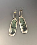 A pair of geometric-shaped fashion earrings with a two-colour marble pattern, made from alloy metal.