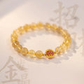 Gold rutilated quartz bracelet with diamond-cut beads in two size options