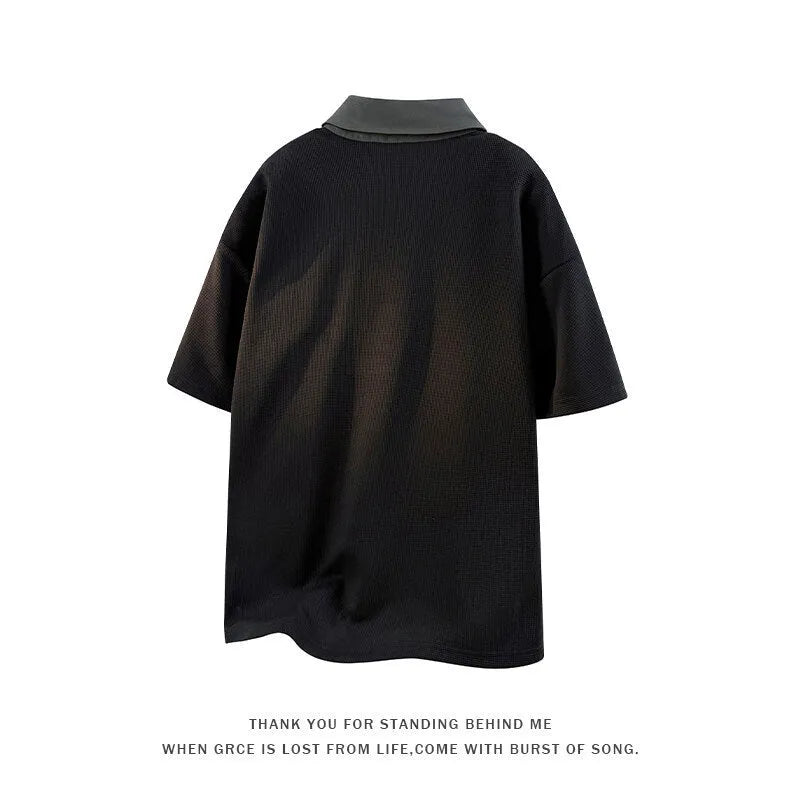 Men's black short sleeve polo sweater with a structured padded Henry collar, made from thin Spandex fabric.
