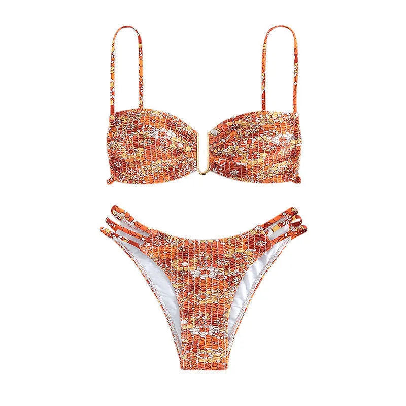 Women's high-waist floral bikini swimsuit in a solid colour on a mannequin