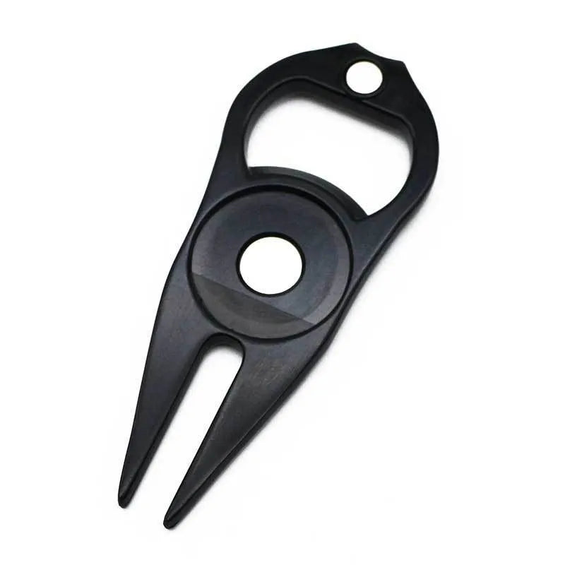 Zinc alloy golf tool with ball yoke and bottle opener, shown with a separate ball marker coin, in black, green, and silver colours.
