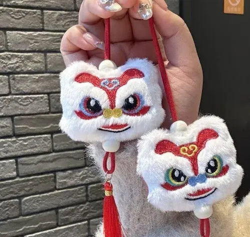 Chinese style plush lion keychain ornament with tassel and star stone accents in blue or yellow