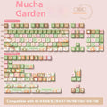 Full set of colourful Summer Garden themed ABS keycaps for mechanical keyboards, laid out on a table.